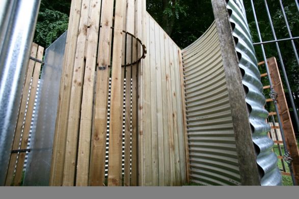 <i>Beyond The Fence</i> (installed at National Museum of Welsh Life, Cardiff). Steel, slate and wood panel fencing, 12x3m. Photo: Betina Skovbro